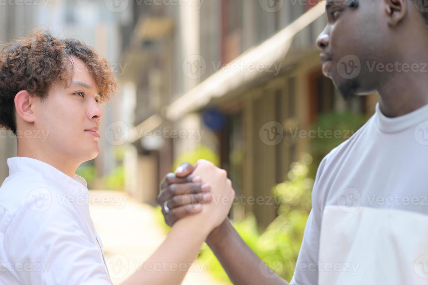 Young multiethnic friend having fun outdoors on beautiful summer day photo