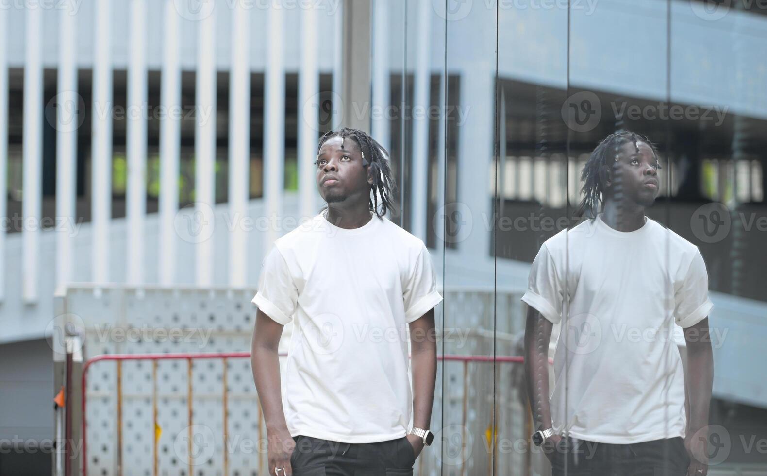 A young man with his hairstyle and the atmosphere of living in the community. photo