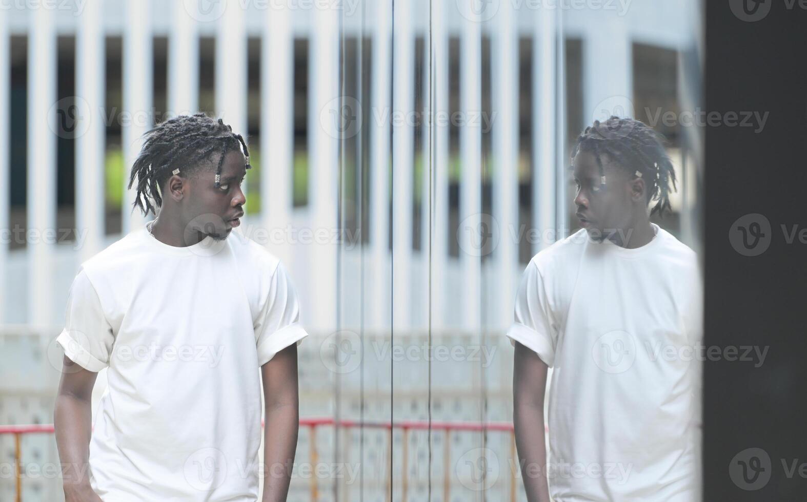 A young man with his hairstyle and the atmosphere of living in the community. photo