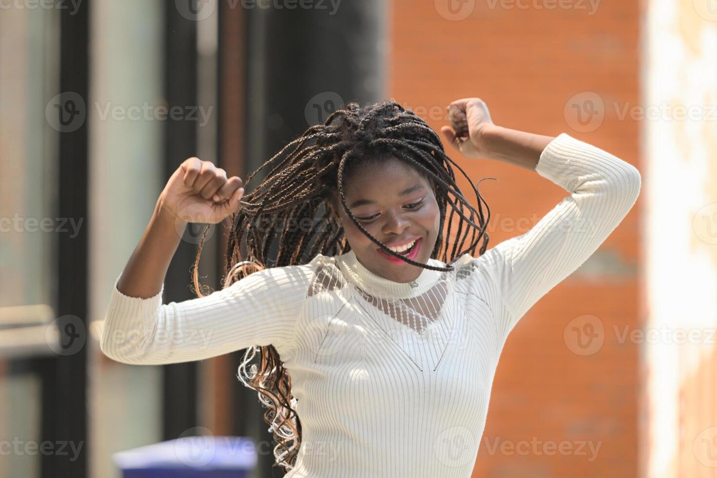 A young woman with his hairstyle and the atmosphere of living in the community. photo