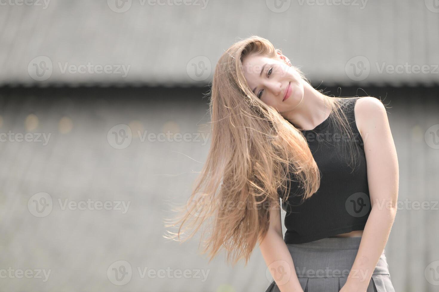 A young woman with his hairstyle and the atmosphere of living in the community. photo