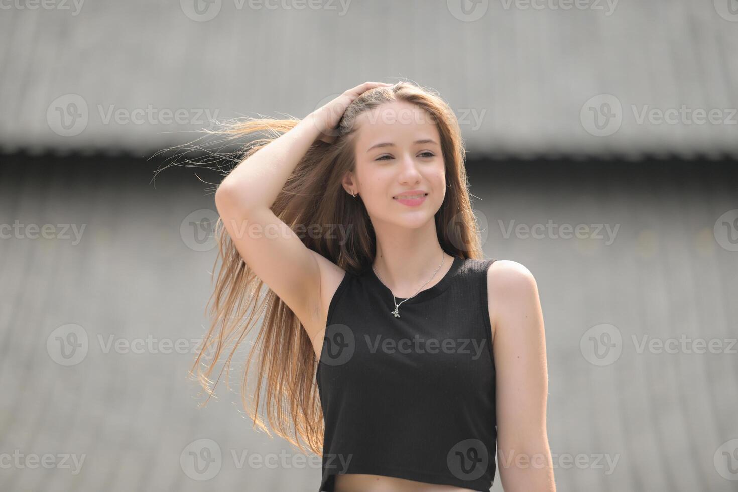 A young woman with his hairstyle and the atmosphere of living in the community. photo