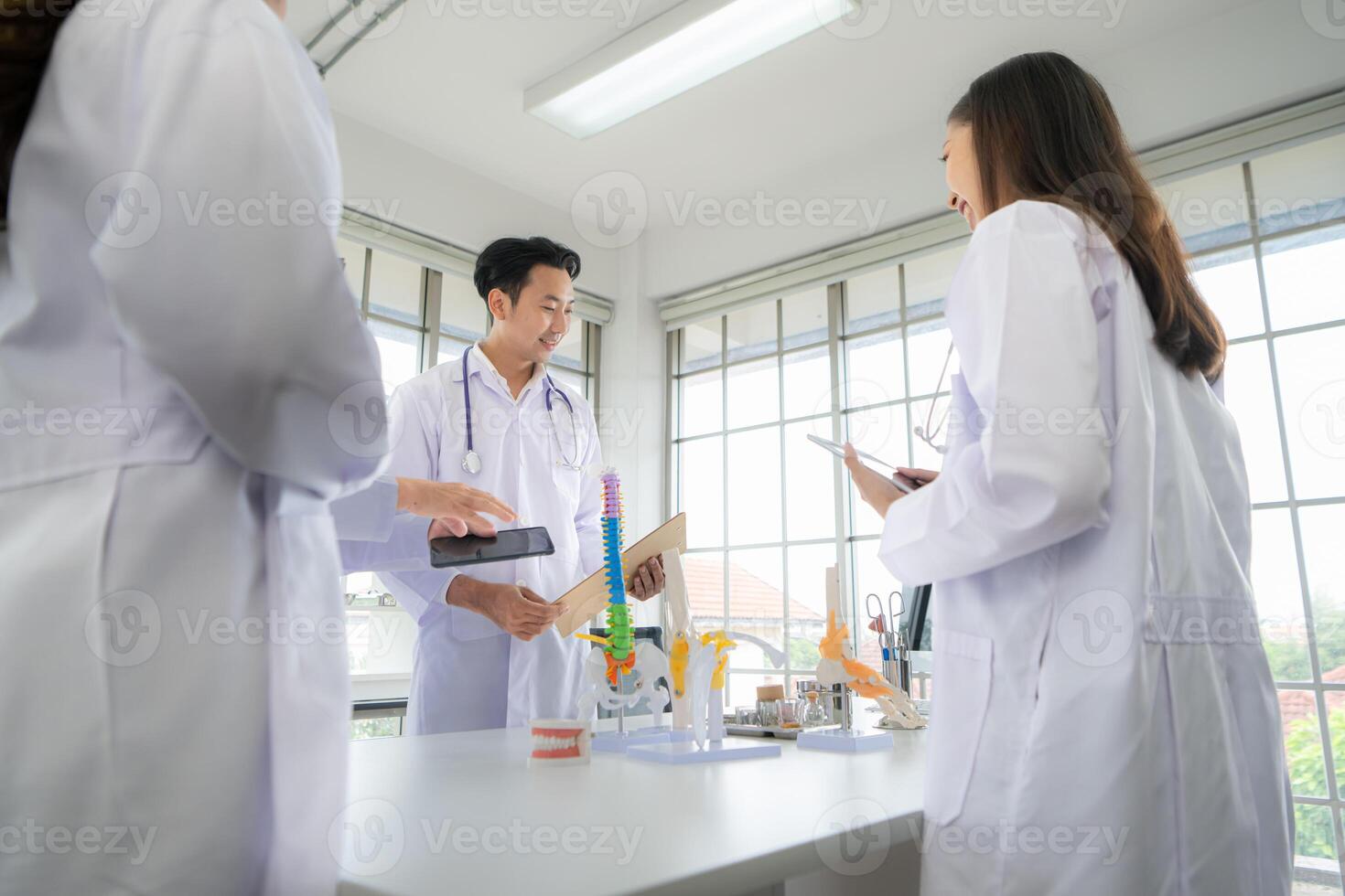 A medical professor is lecturing on a case study related to disease treatment to medical students photo