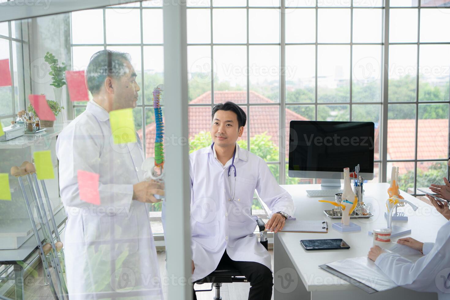 A medical professor is lecturing on a case study related to disease treatment to medical students photo