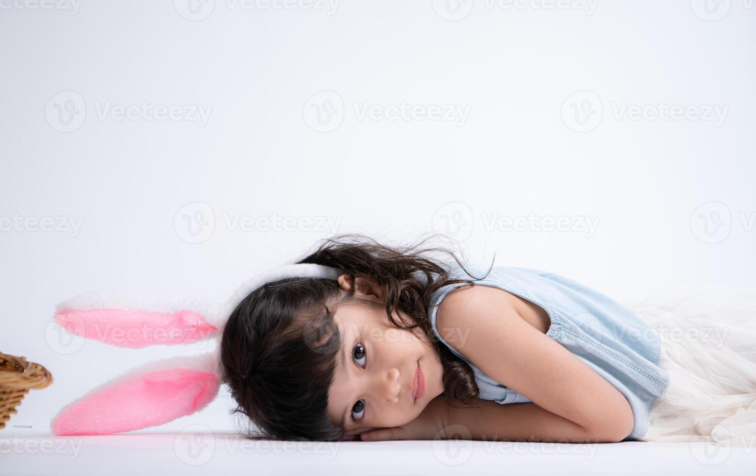 Smiling little girl and with their beloved fluffy rabbit, showcasing the beauty of friendship between humans and animals photo