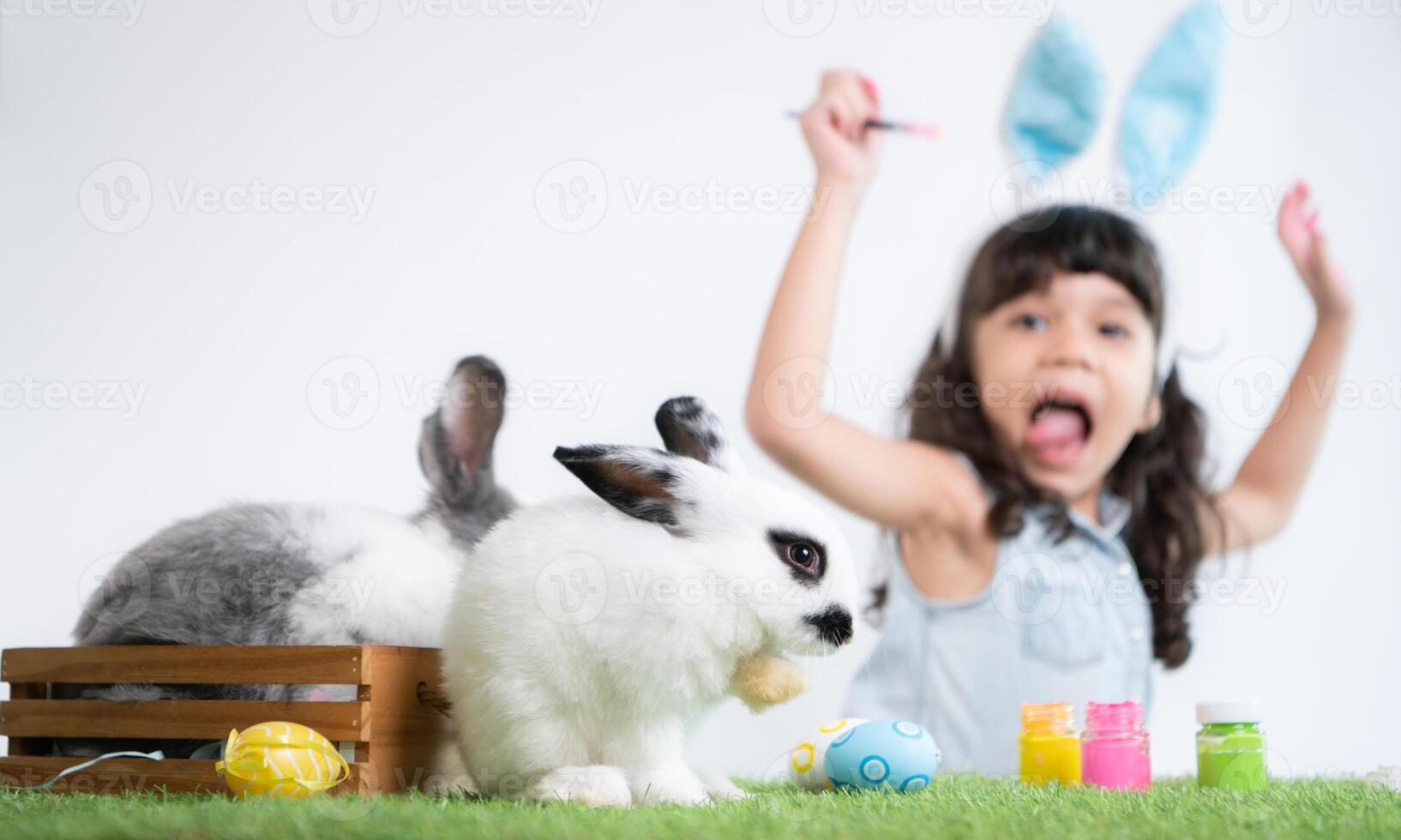 Easter bunny fun with little children the beauty of friendship between humans and animals photo