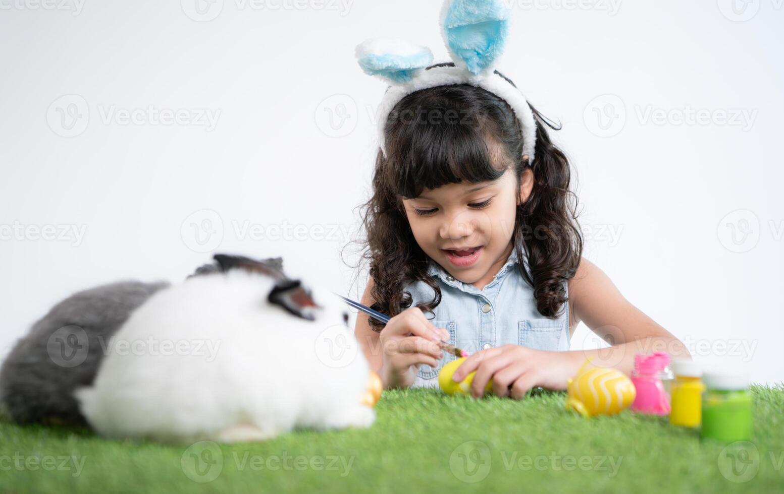 Easter bunny fun with little children the beauty of friendship between humans and animals photo