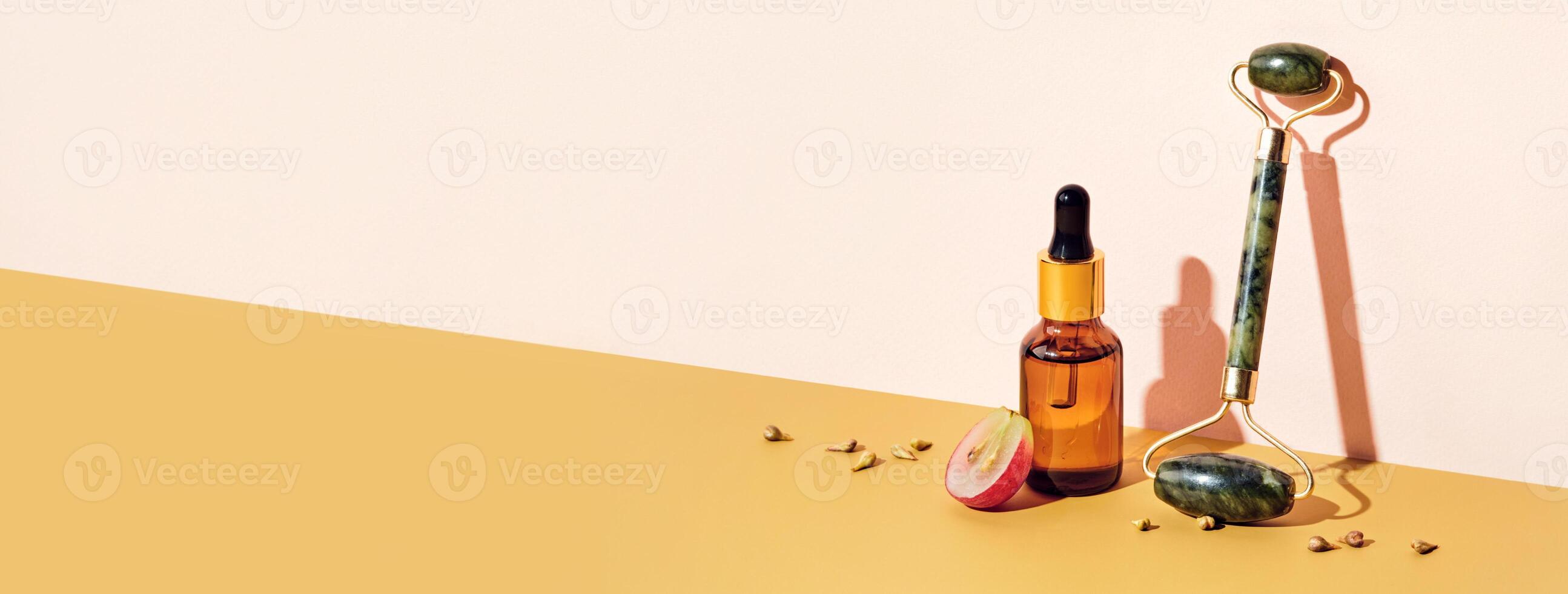 Banner with Organic grape seed oil cosmetics and massage roller. Zero Waste Winemaking. Skincare cosmetic product, diagonal isometric view and shadow photo