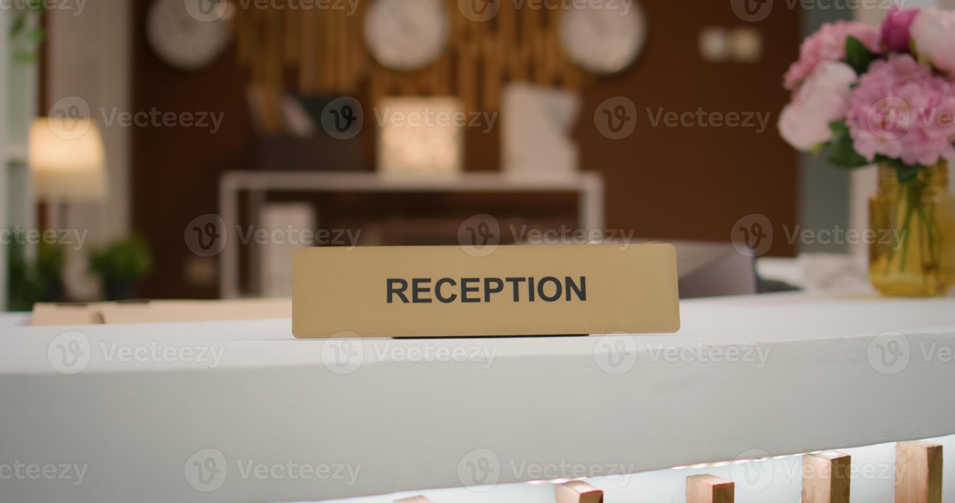 Empty luxurious hotel lounge area with stylish couch and modern front desk reception, beautiful interior design. Five star holiday retreat lobby decorated with cool lights, luxurious space. photo