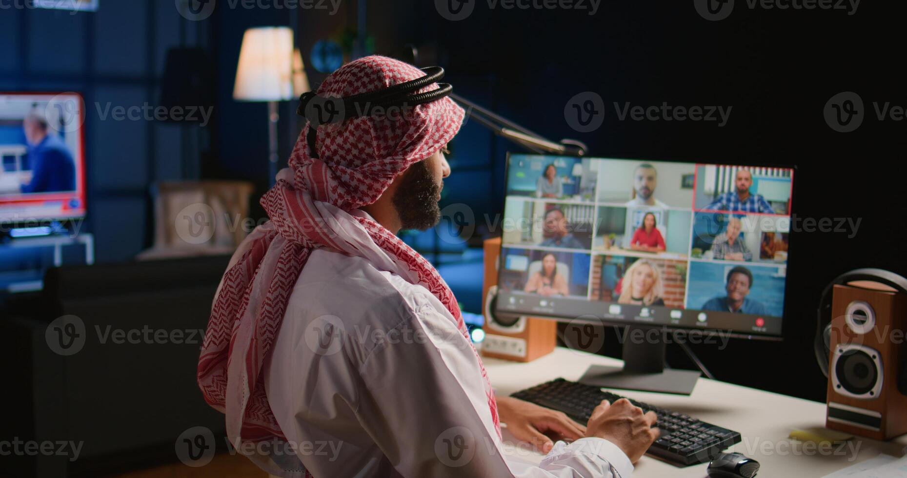 Remote Middle Eastern professional holding q and a session with webinar participants via video conference meeting. Muslim Internet video call host engaging in online discussions with trainees photo