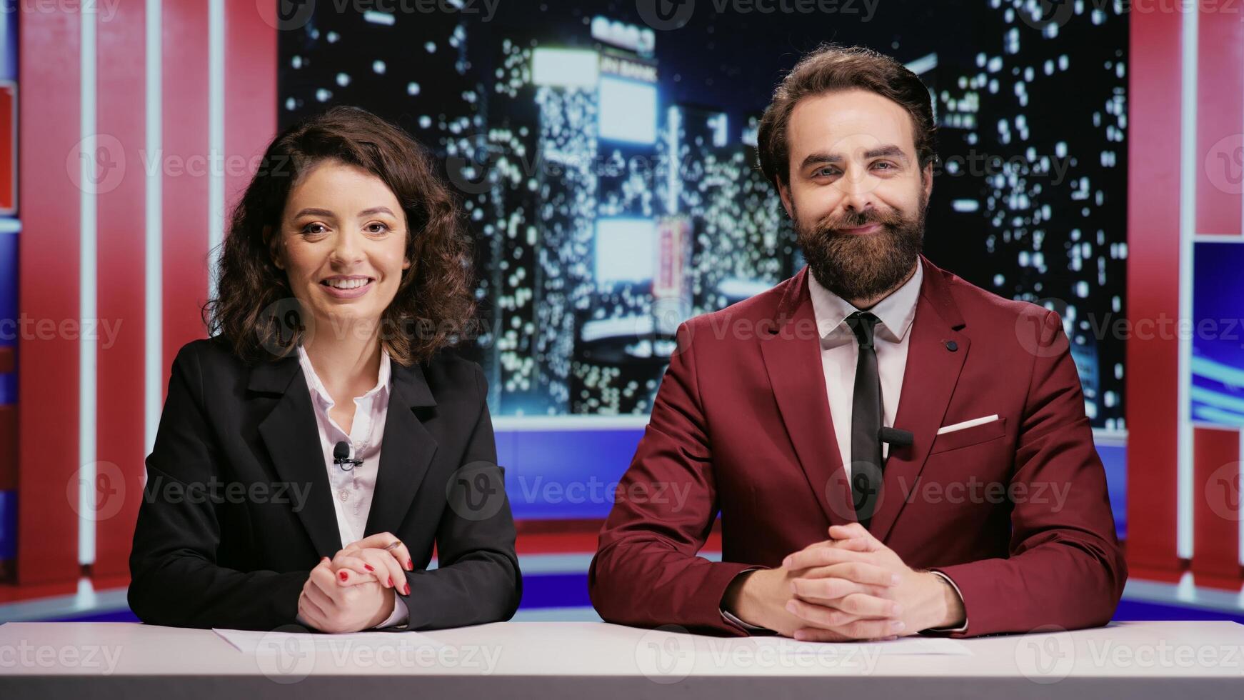 Reporters team hosting night show late to discuss about latest celebrity scandals in newsroom, covering all important topics on worldwide television network. Broadcasters hosts presenting breaking news. photo