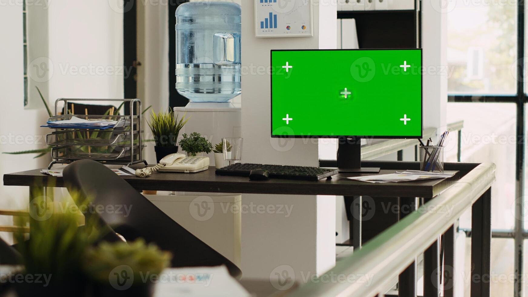 Empty coworking space with pc running isolated greenscreen, blank chromakey display on monitor. Office desk with computer showing mockup template, copyspace layout on desktop. photo