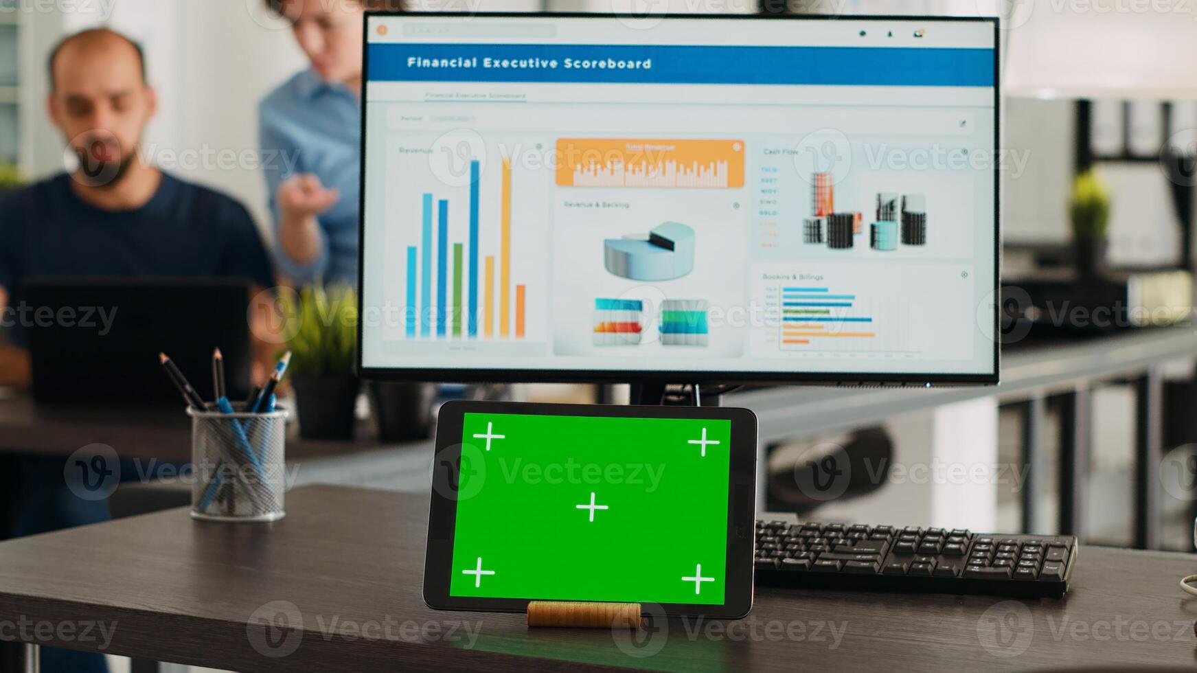 Workstation with greenscreen on tablet device in collaborative workspace for creative firm. In small company workroom advanced gadget displays mockup isolated copyspace screen. photo