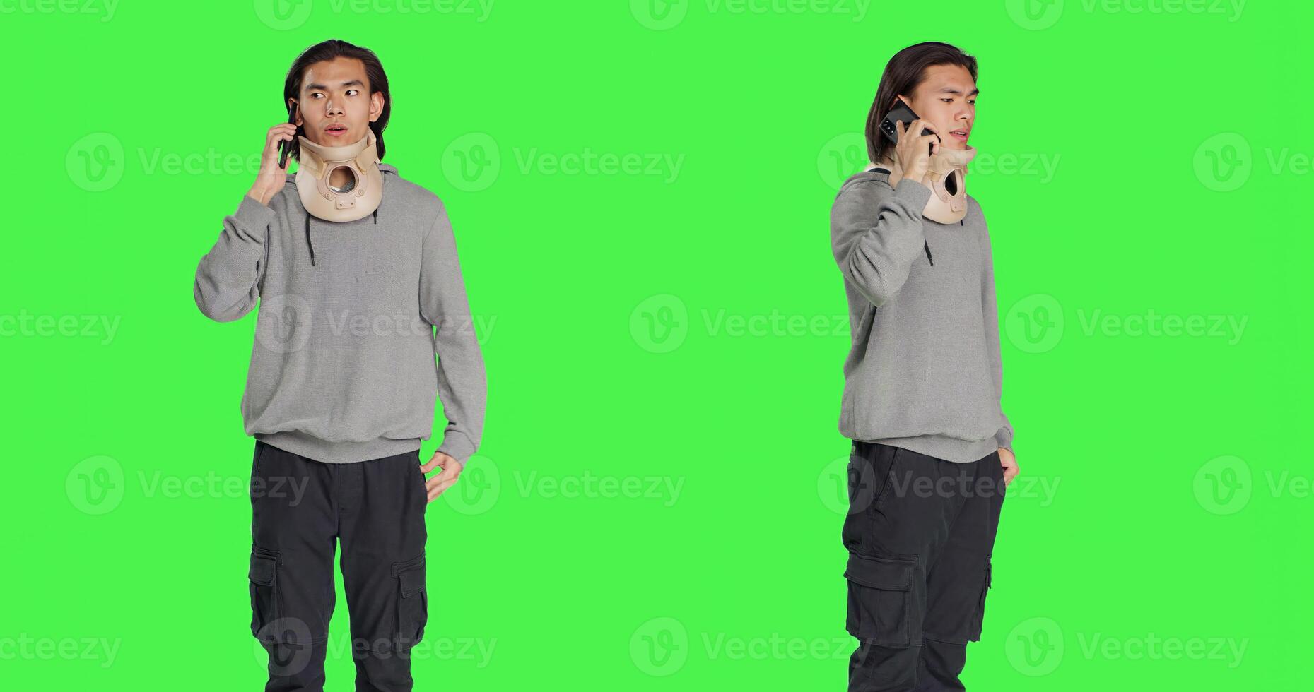 Young adult with neck collar answers call on smartphone, talking to people about his bone fracture accident. Hurt person wearing cervical foam brace discussing on telephone line, greenscreen. photo