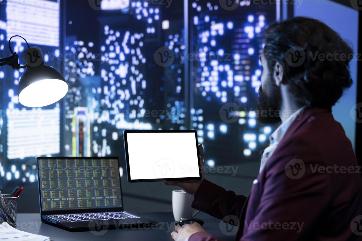 Business investor holding tablet with white screen layout, looking at legal analytics stock market trends online on internet statistics. Chief executive officer using white screen layout on gadget, panorama view. photo