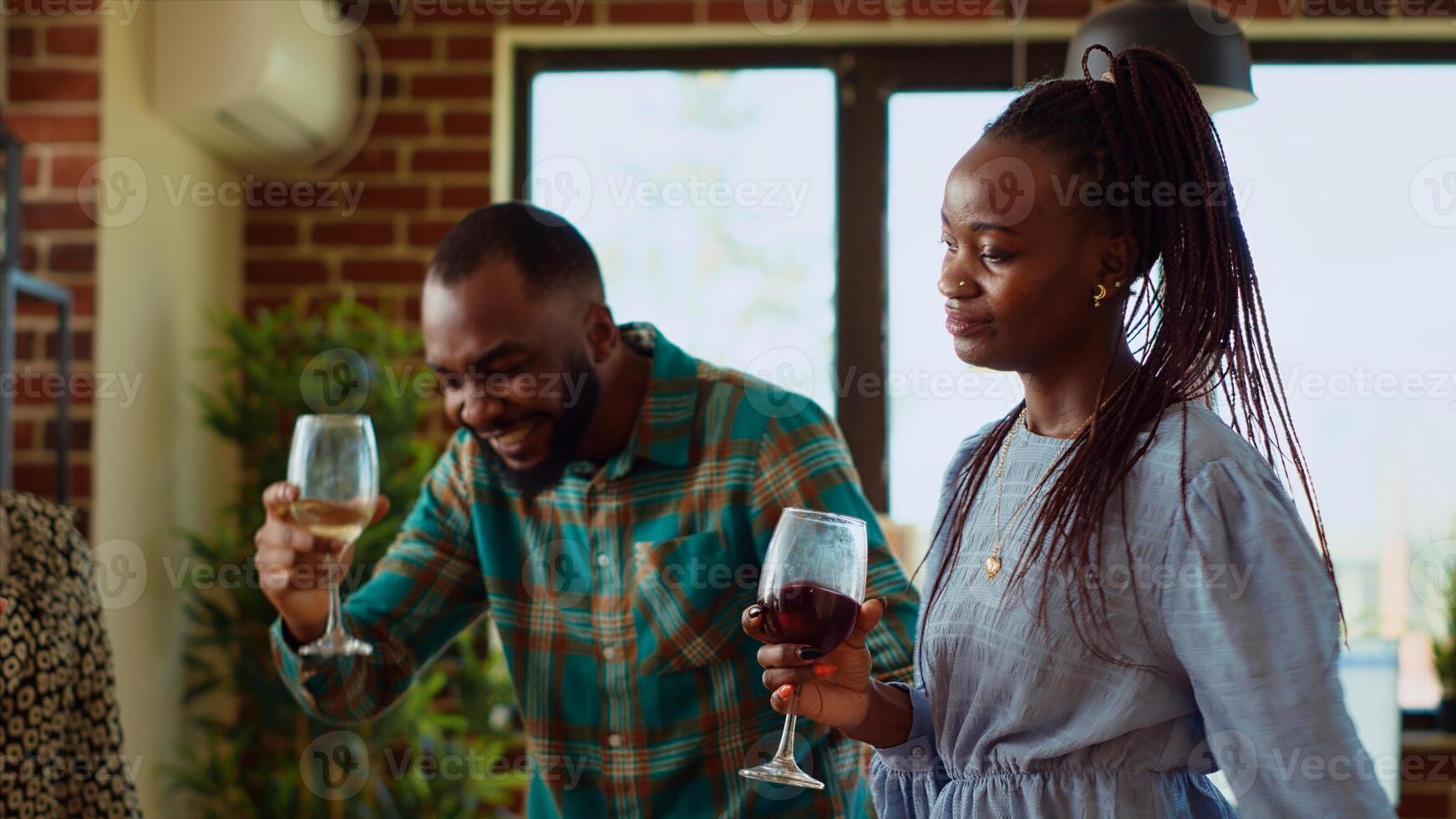 School colleagues organizing reunion party at home, enthusiastically dancing to disco music. Friends celebrating many years of friendship, enjoying, busting into skillful dance moves at social event photo