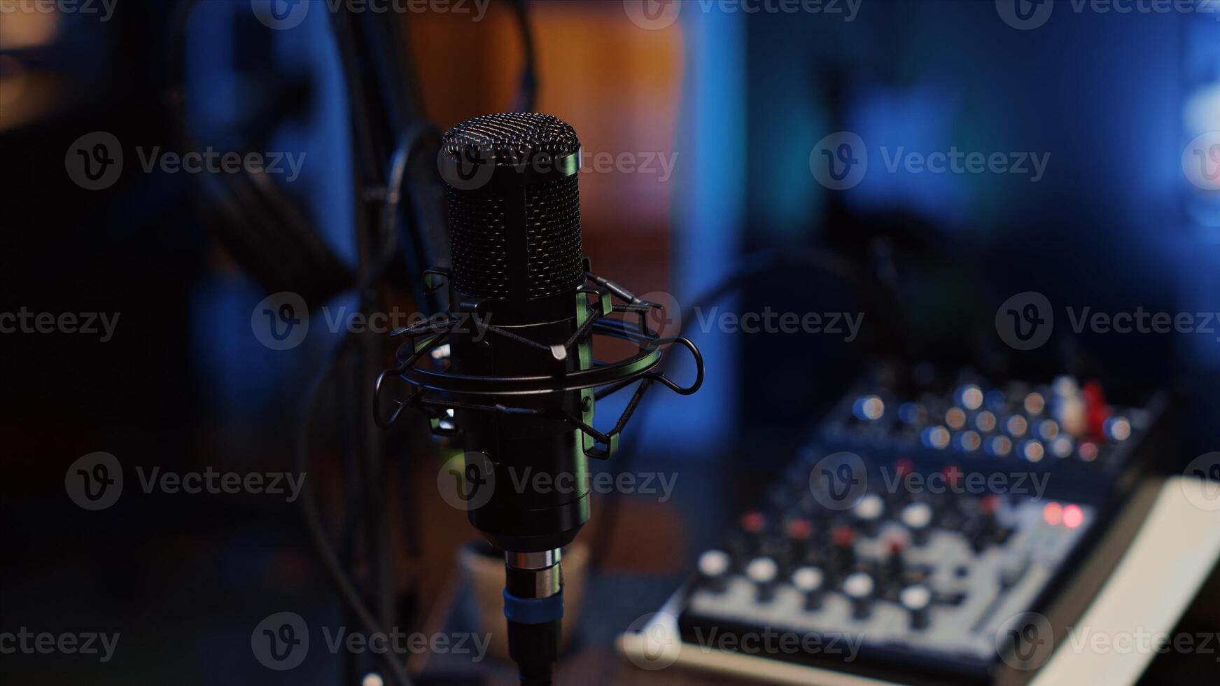 Close up shot of professional microphone used to record podcast conversations for online livestreaming channel. High quality sound capturing and recording gear in apartment studio photo