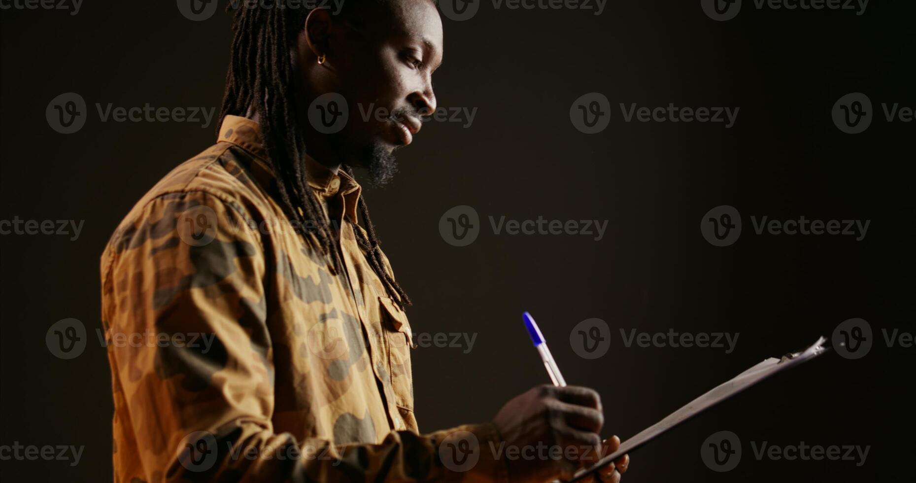 Model checking information on reports using clipboard files, working to create new survey or weekly planner. Person reviewing items on checklist, taking notes with important data. Handheld shot. photo