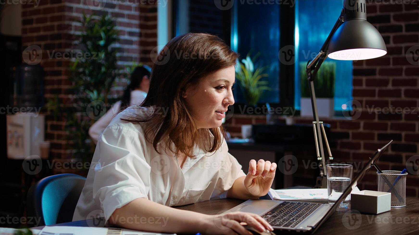 Happy employee reading email on laptop received from customer, excited after managing to secure lucrative deal for company. Businesswoman celebrating finalizing agreement with client, camera A photo