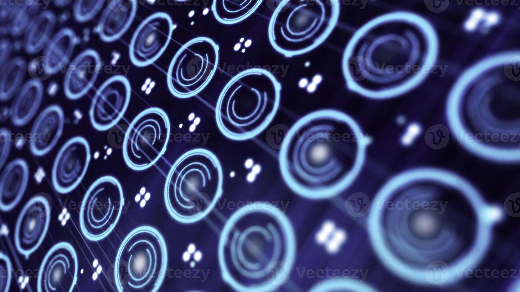 Pattern of small blue spinning circles and pixels moving on a electronic screen. Close-up of rotating neon circles. photo