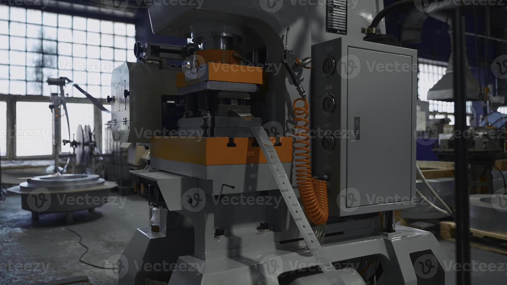 Machines with hole punch for metal line. Creative. Long metal line on industrial machines. Workshop with automated machines at metallurgical plant photo