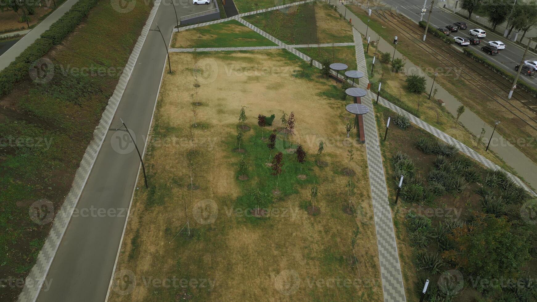 Top view of paths in park alley. Clip. Solar panels in park alley of city. Lines of paths in park city alley of residential area photo