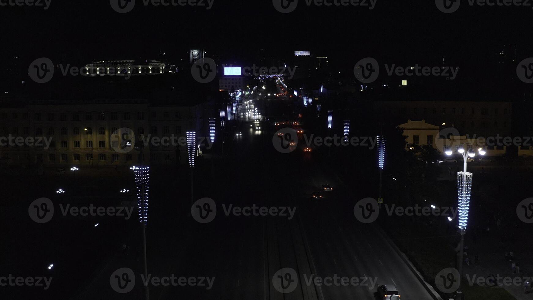 Top view of modern night city with cars and lanterns. Stock footage. Night city highway with moving cars and glowing lanterns. Beautiful night city with cars and garlands on lanterns photo
