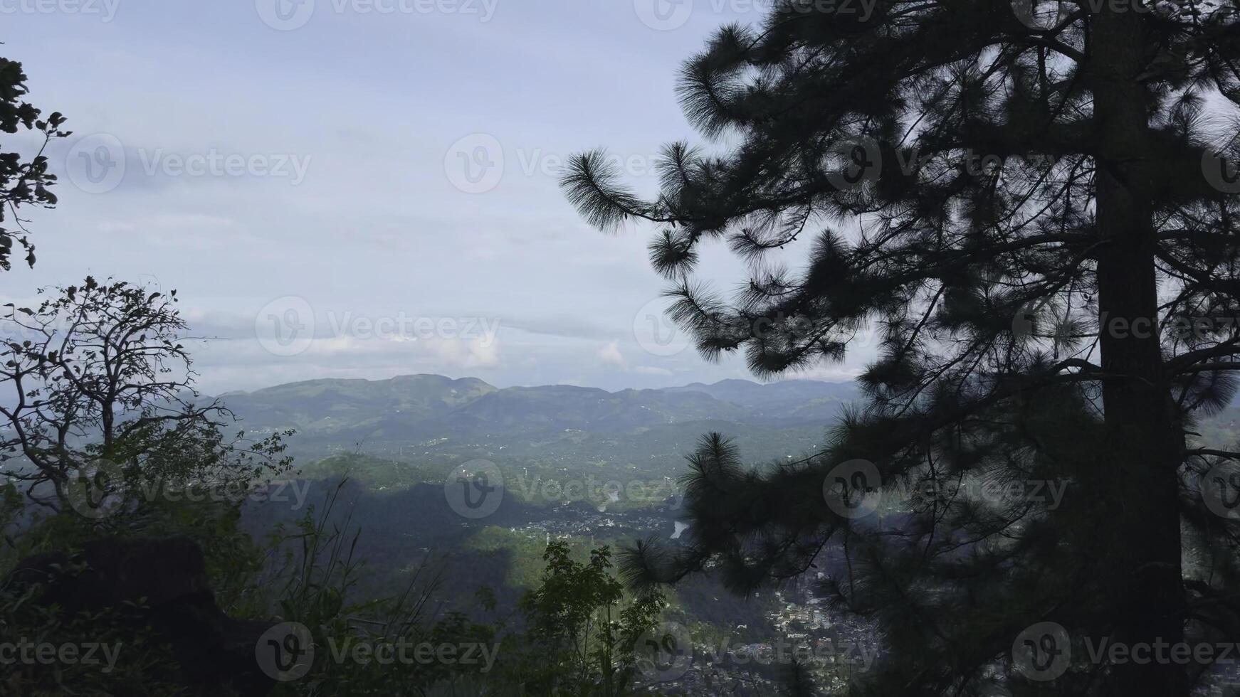 Mountain view from car driving along serpentine. Action. Trip by car on serpentine overlooking mountains on summer day. Cloudy landscape of mountain valley from car driving along serpentine photo