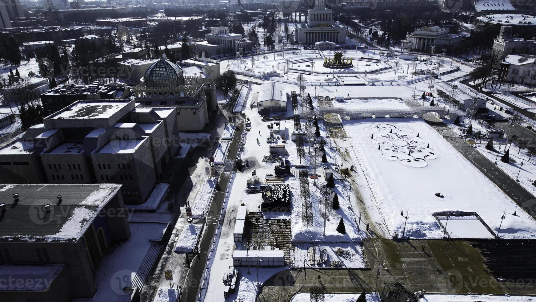 Top view of historic city center with squares and monuments in winter. Creative. Long alley of historical monuments and architecture of city on sunny winter day. Long square with monuments and photo