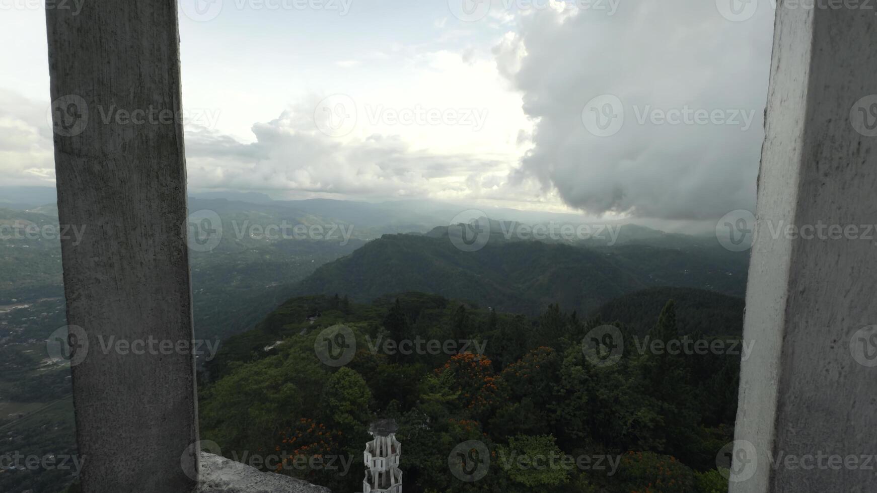 View of green mountains from ancient tower. Action. Beautiful view of green mountains from historic tower. Tourist observation deck from ancient tower in green mountains photo