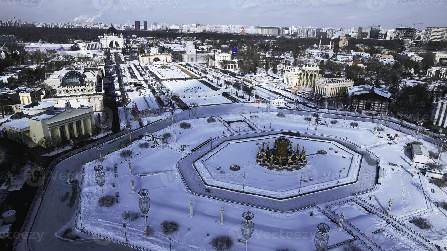 Historic square with fountain in winter. Creative. Top view of beautiful square with fountain on sunny winter day. Historical square of Soviet city with beautiful architecture in winter photo