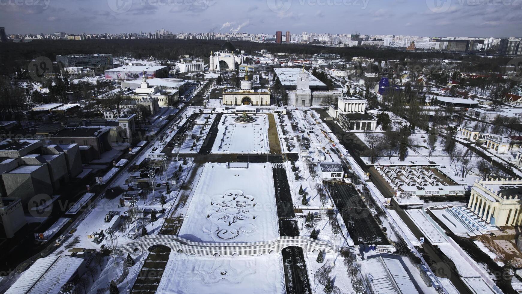 Top view of large square with historical architecture in winter. Creative. Historic square with alleys and Soviet architecture in city center. Winter landscape with Soviet architecture on background photo