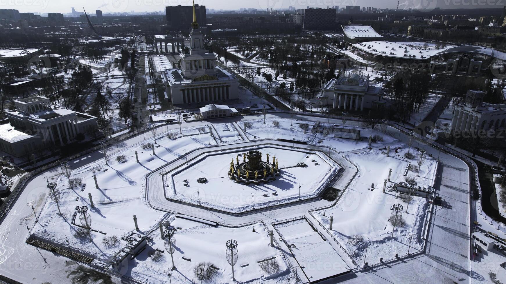 Top view of round square in winter. Creative. Beautiful historical square with fountain on sunny winter day. Sovetskaya Square with architecture and square in city center photo