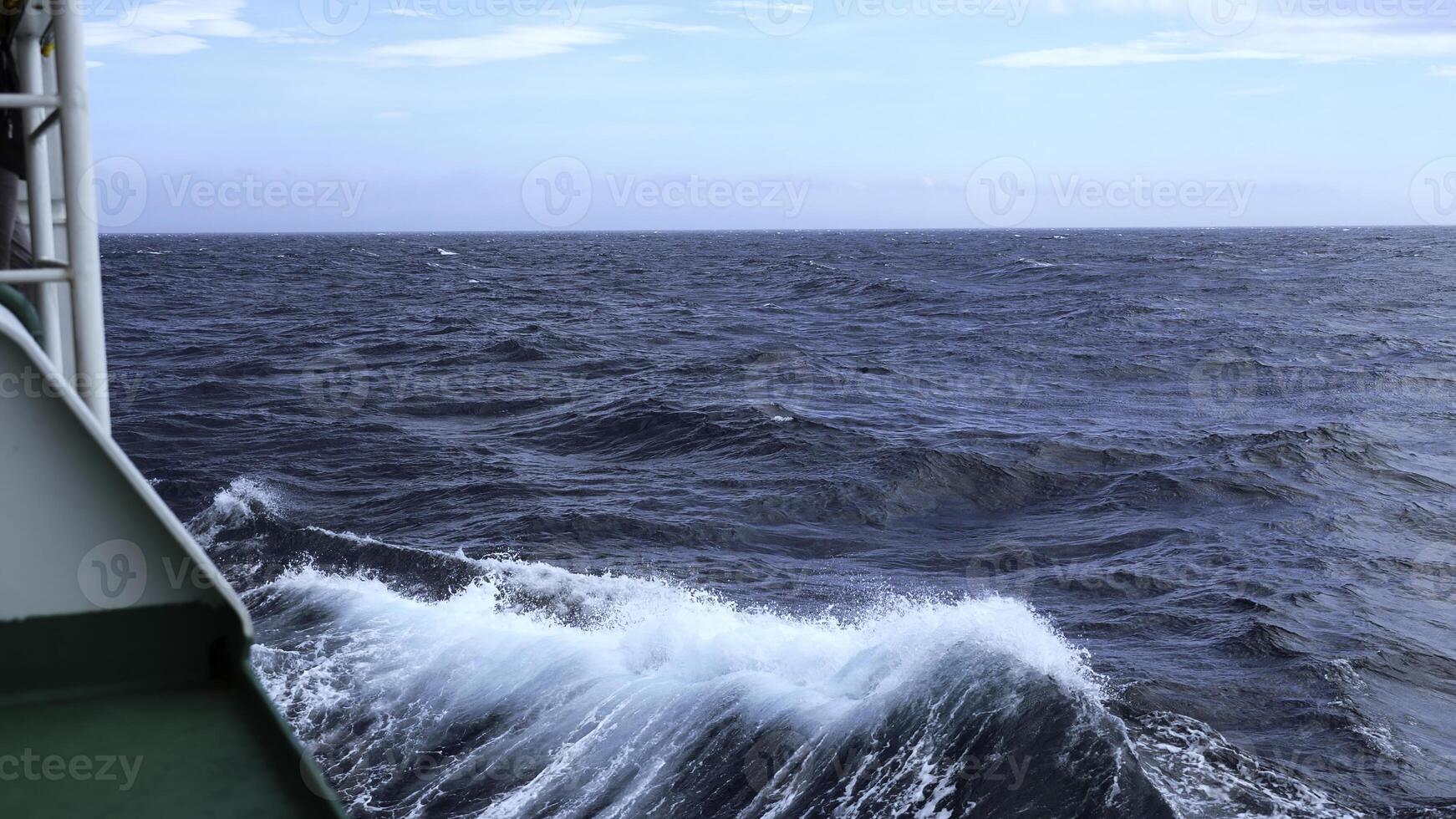 Waves from floating sea vessel. Clip. Beautiful moving waves from floating ship at sea. Beautiful sea horizon with moving waves from ship photo