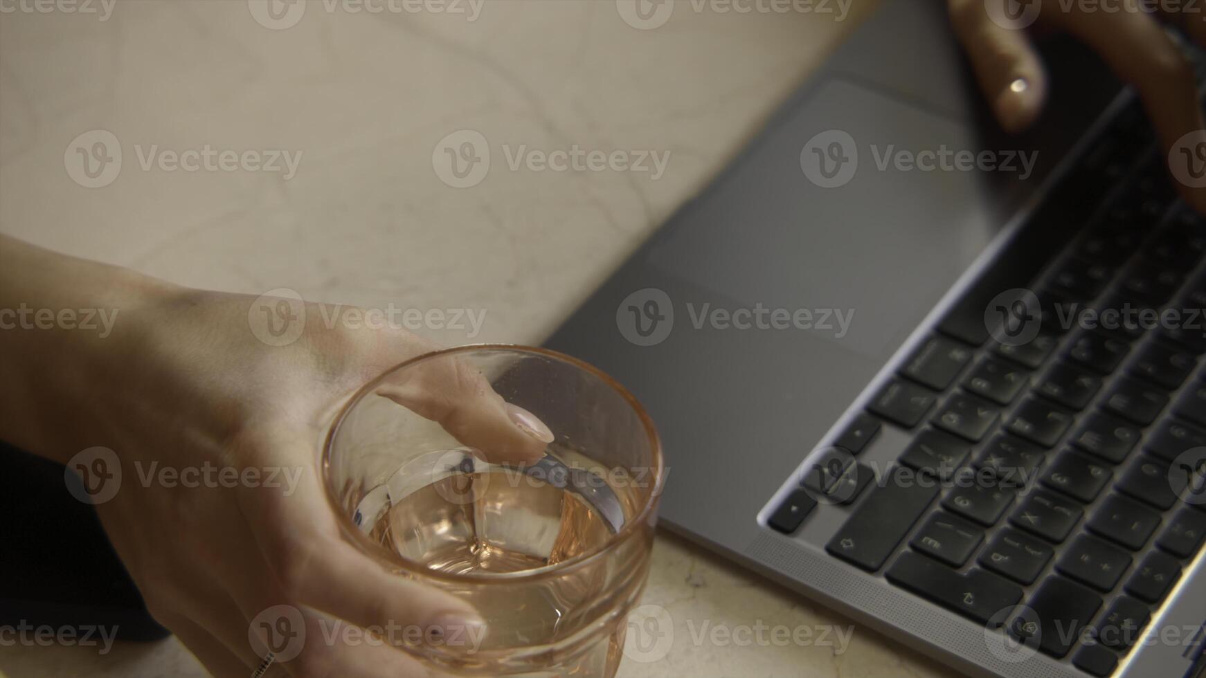 Close-up of beautiful woman typing on laptop. Stock footage. Beautiful female hands are typing on laptop keyboard. Female freelancer works at laptop in cafe photo