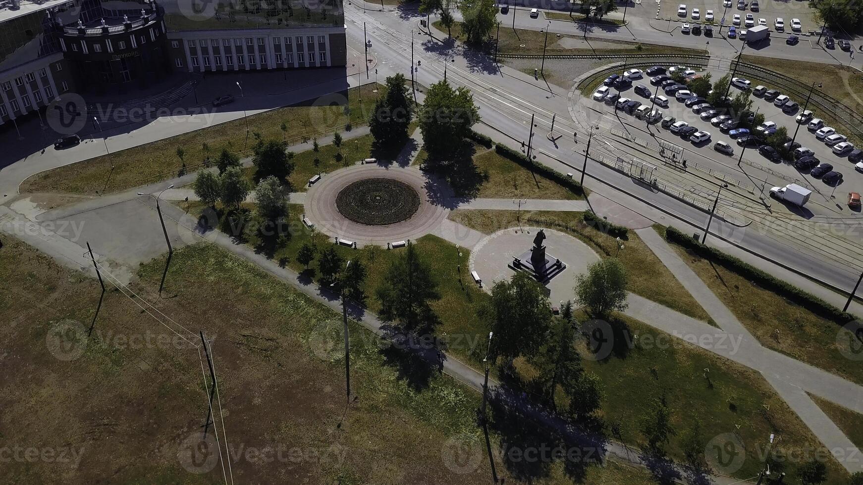 Aerial view of a beautiful green housing estate. Clip. Flying above summer city with green park. photo