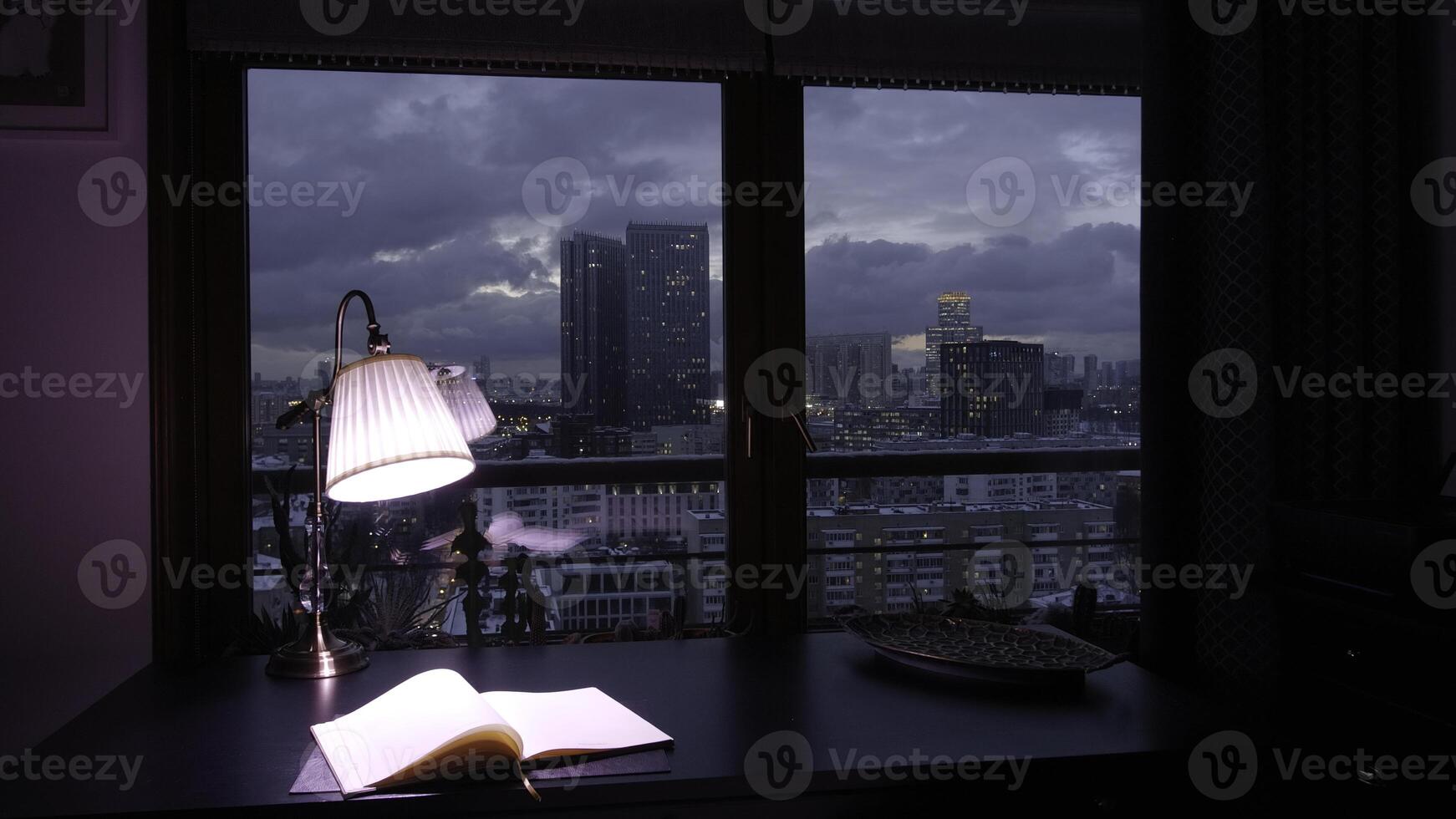 Working at home concept. Creative. Turning on and off the lamp with color change, daily planner and decorative vase on the table. photo