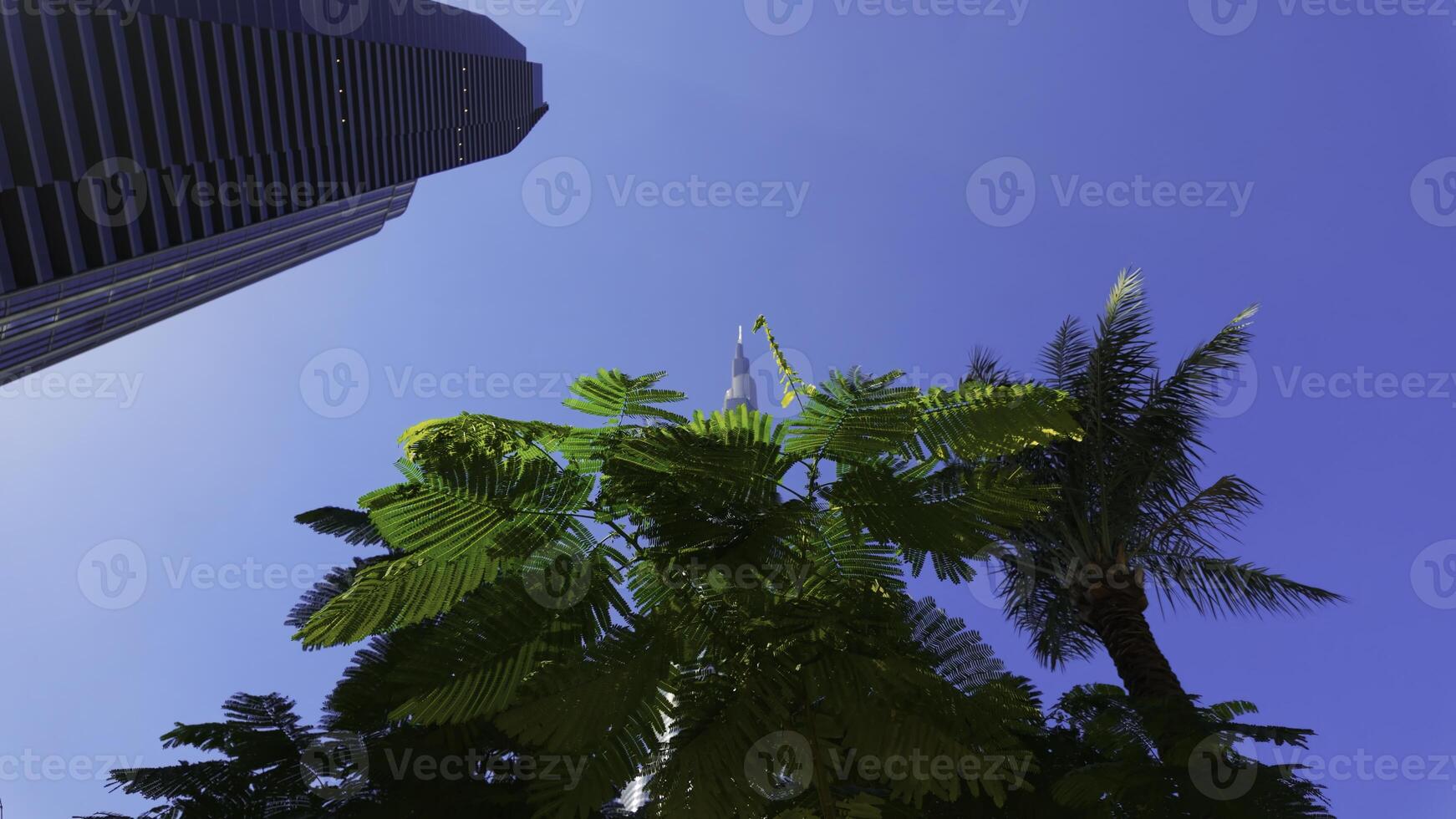 Ground angle of blue sky with tall buildings around. Action. Giant skyscrapers and summer nature. photo