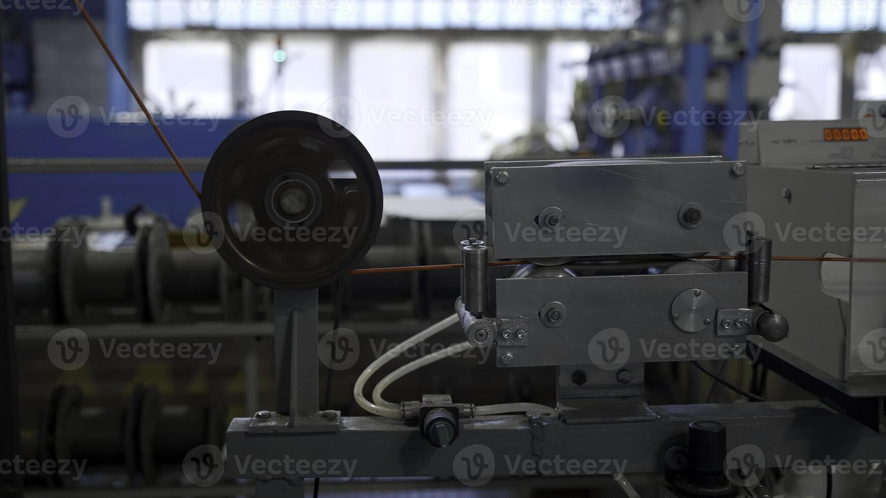 Cable production process, mechanism in a cable factory. Creative. Industrial background with spinning coils. photo