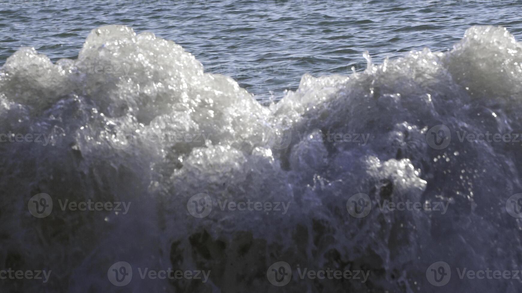 Slow motion of ocean waves crashing on beach. Creative. Beauty of nature. photo