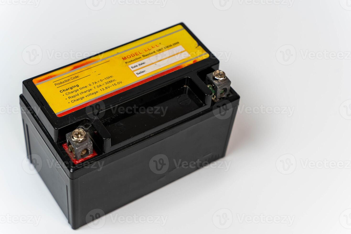 Small battery for moped or motorcycle on white background with copy space photo