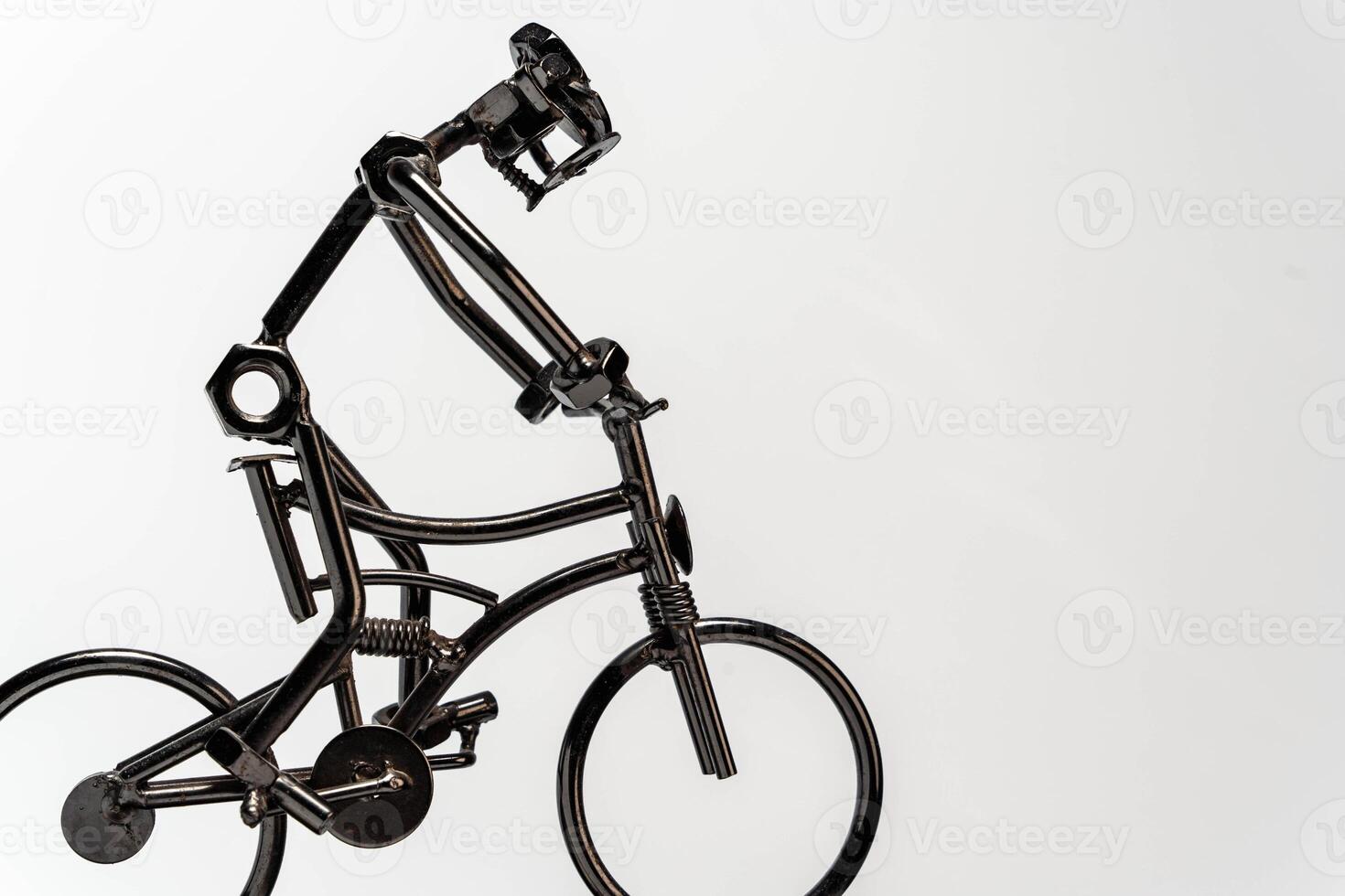 Metal parts cyclist sculpture on white background with copy space photo