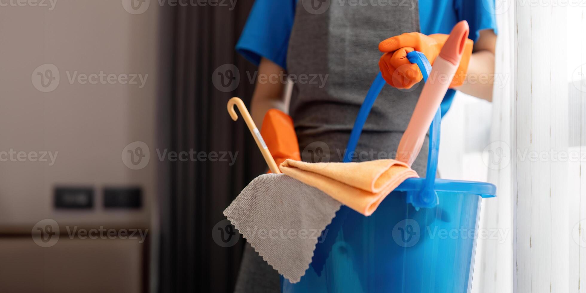 Cleaning product, and basket with woman asian staff cleaning service in bedroom to clean bacteria at apartment. cleaner or maid with container to work in room photo