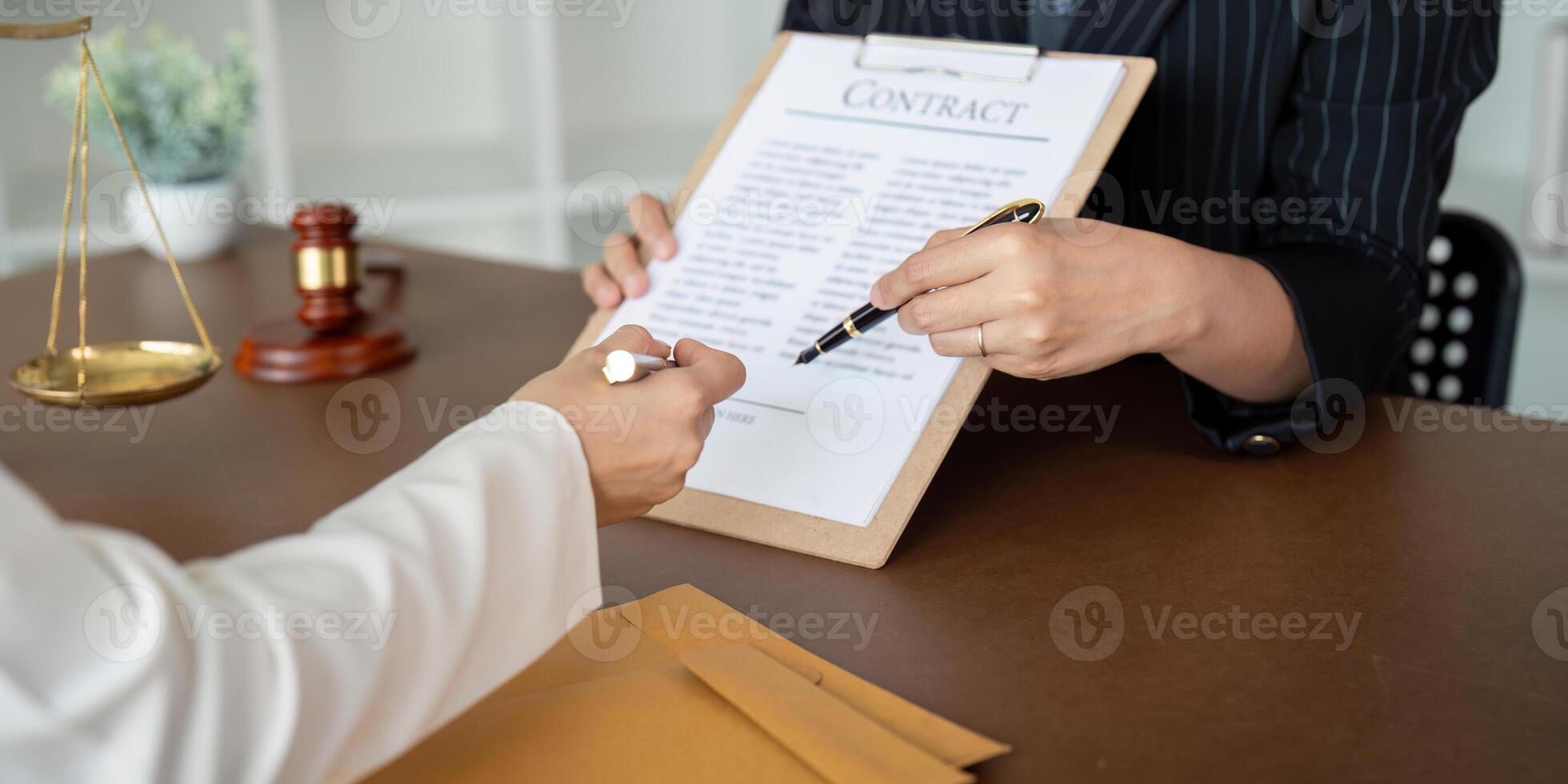Contract of sale was on the table in the lawyer office the company hired the lawyer office as a legal advisor and draft the contract so that the client could signs the right contract photo