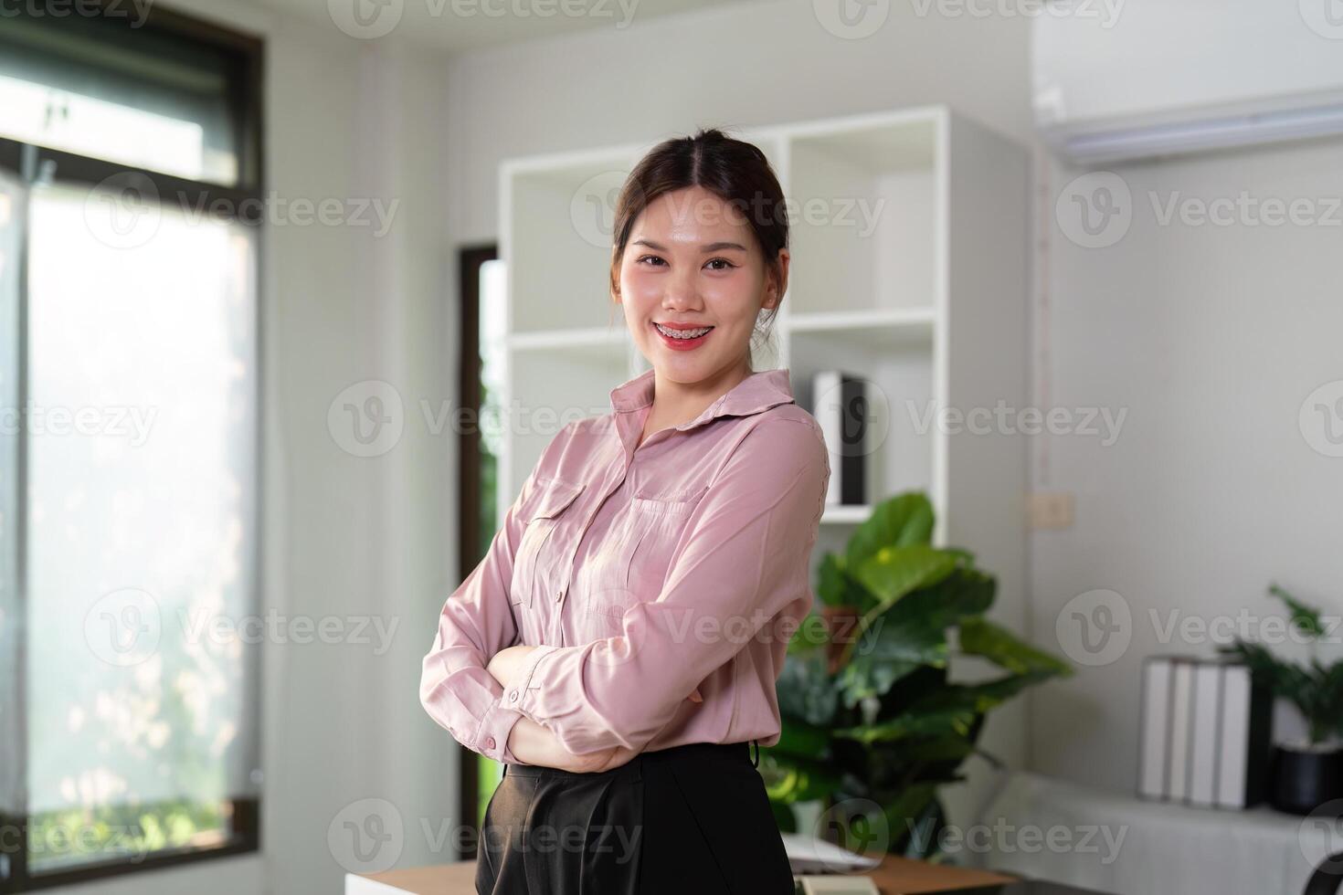 Young successful employee business woman at desk at office. Achievement career concept photo