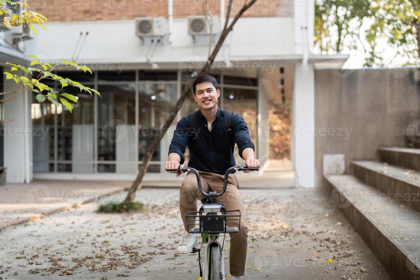 Businessman and bicycle in city to work with eco friendly transport. happy businessman professional riding a bicycle in urban street photo