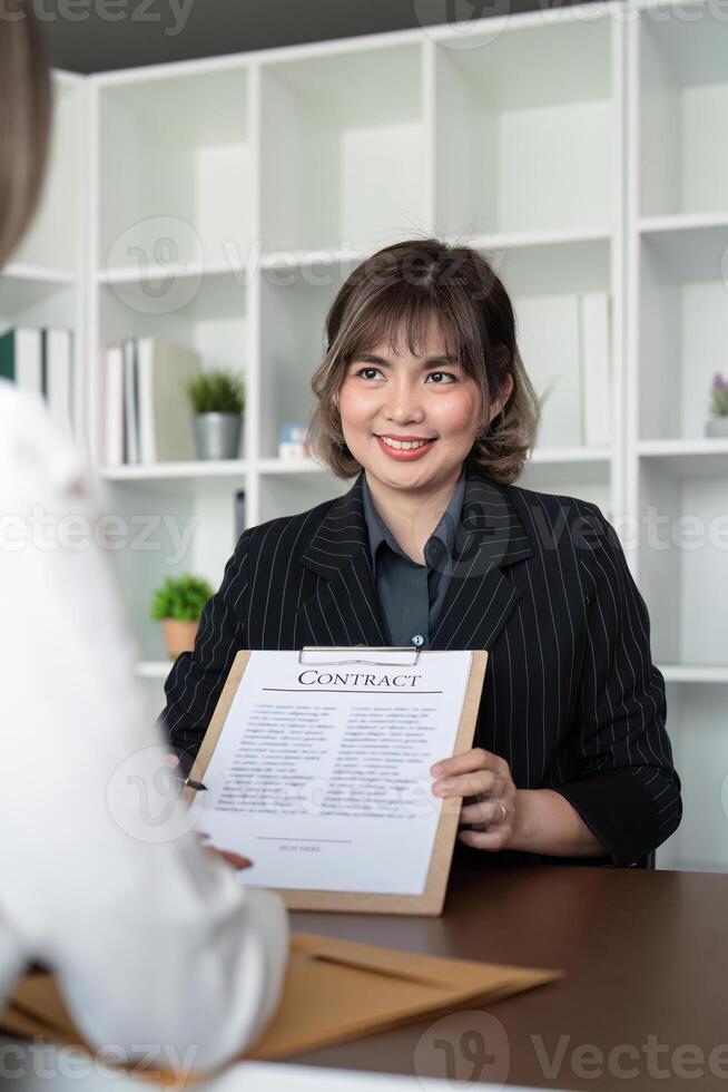 Company hired the lawyer office as a legal advisor and draft the contract so that the client could signs the right contract. Contract of sale was on the table in the lawyer office photo