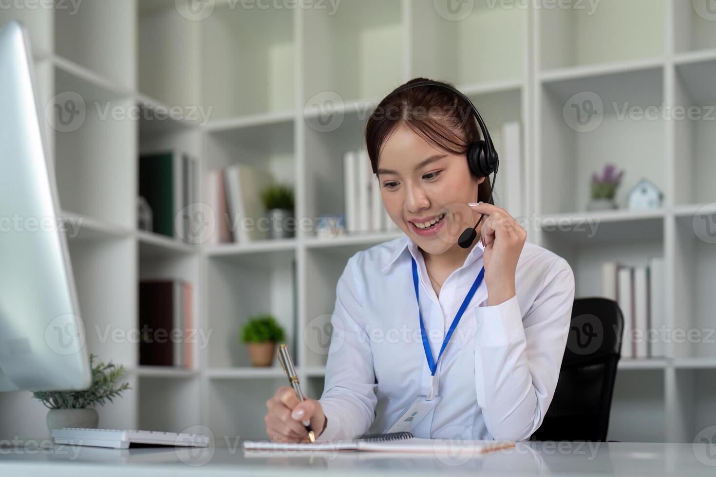 Call center friendly woman asian in office for customer service, technical support and advice, contact and communication with employee operator in help desk agency photo