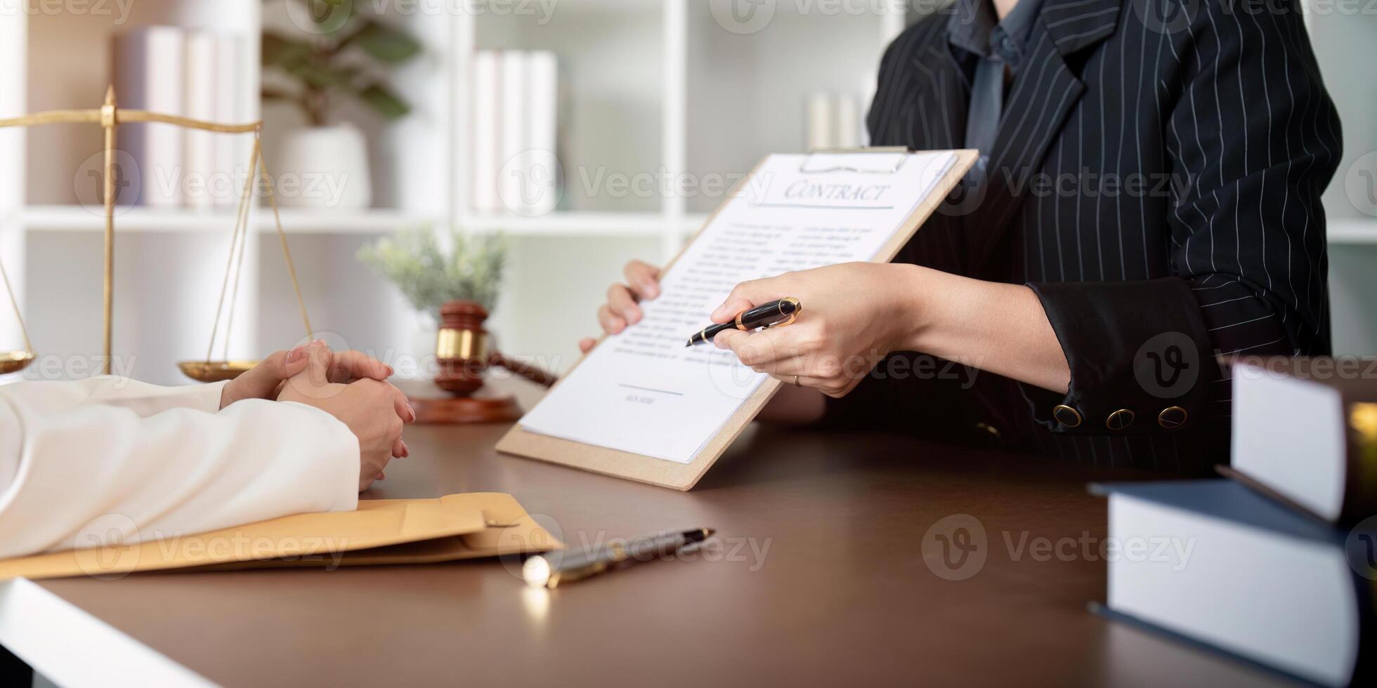 Contract of sale was on the table in the lawyer office the company hired the lawyer office as a legal advisor and draft the contract so that the client could signs the right contract photo