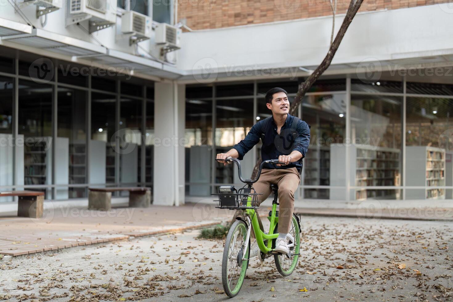 Businessman and bicycle in city to work with eco friendly transport. happy businessman professional riding a bicycle in urban street photo